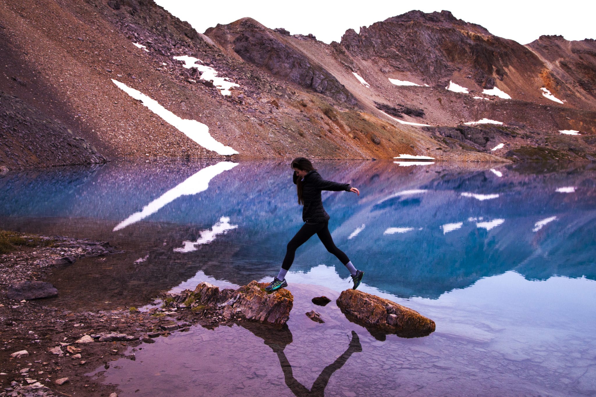 Canva - Woman Hopping on Brown Rock Fragments